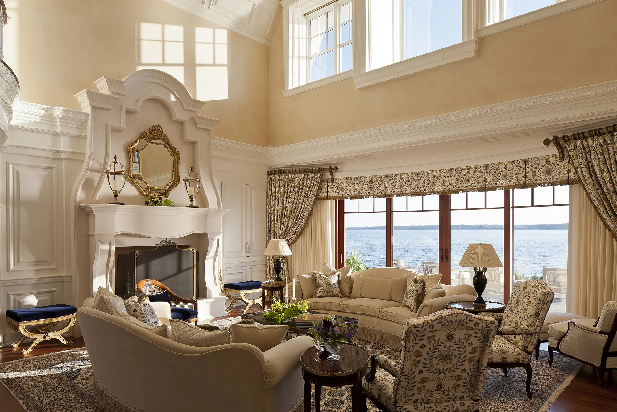 Open living room with extravagant, carved fireplace hearth
