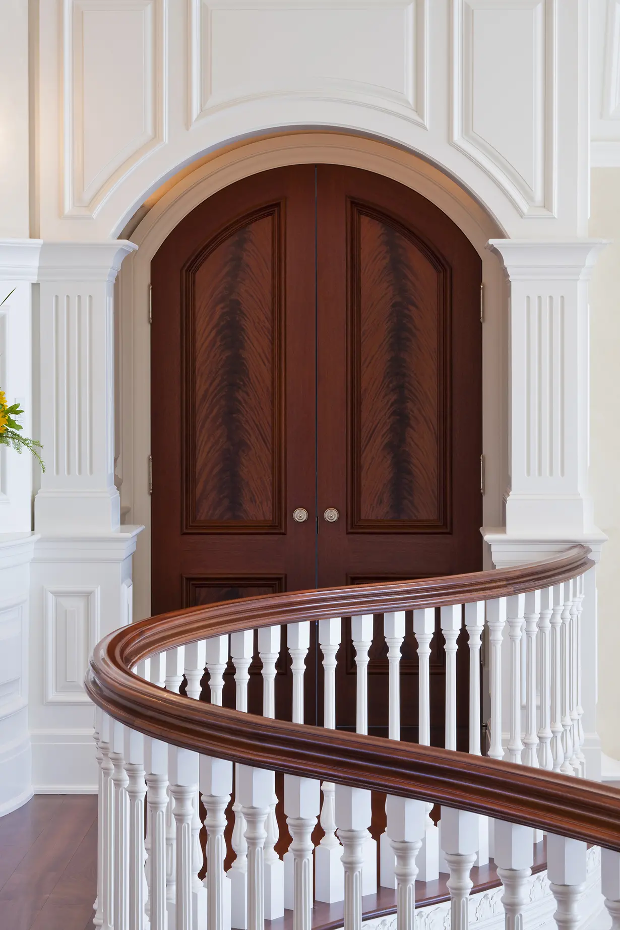 View of doorway and detailed moldings from stairs
