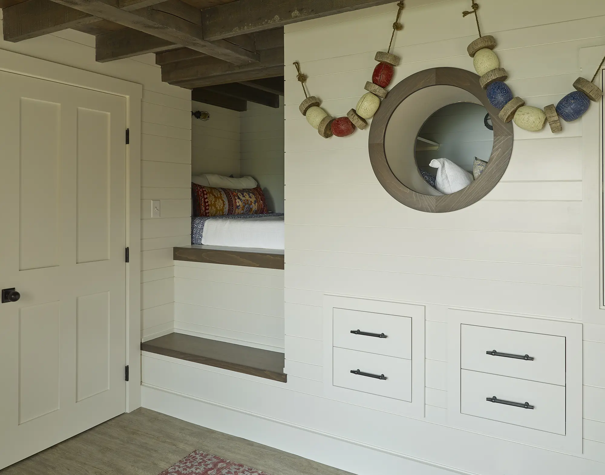 Cozy bedroom nook with built in storage at the bunkhouse at Basque in the Sun