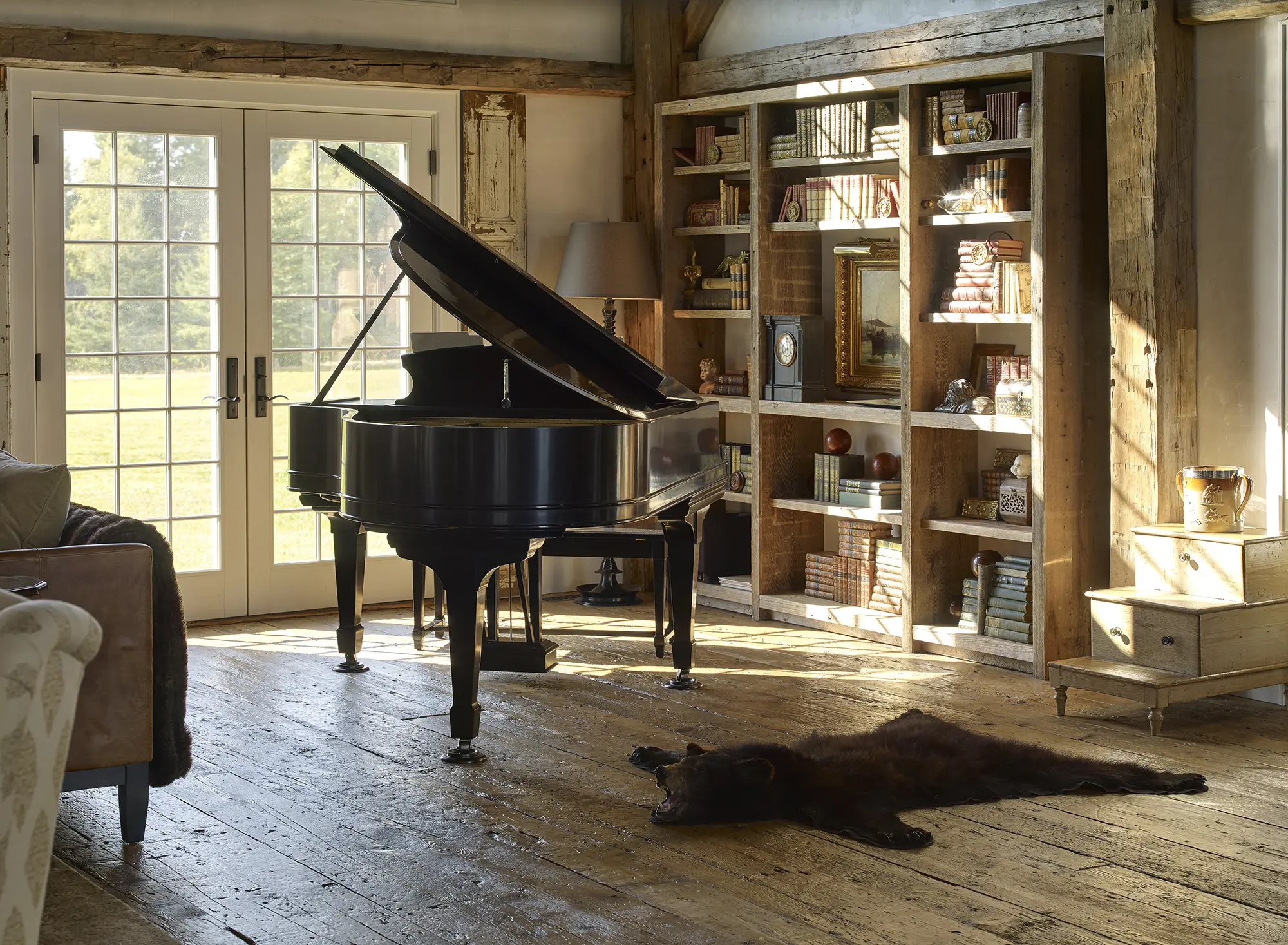Large piano sits in a corner of this rustic living area