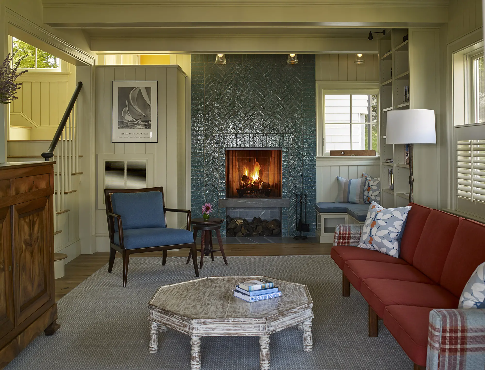 Cozy sitting area with a herringbone brick fireplace