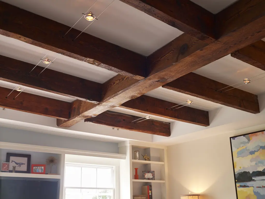 Cable lighting running through exposed beams