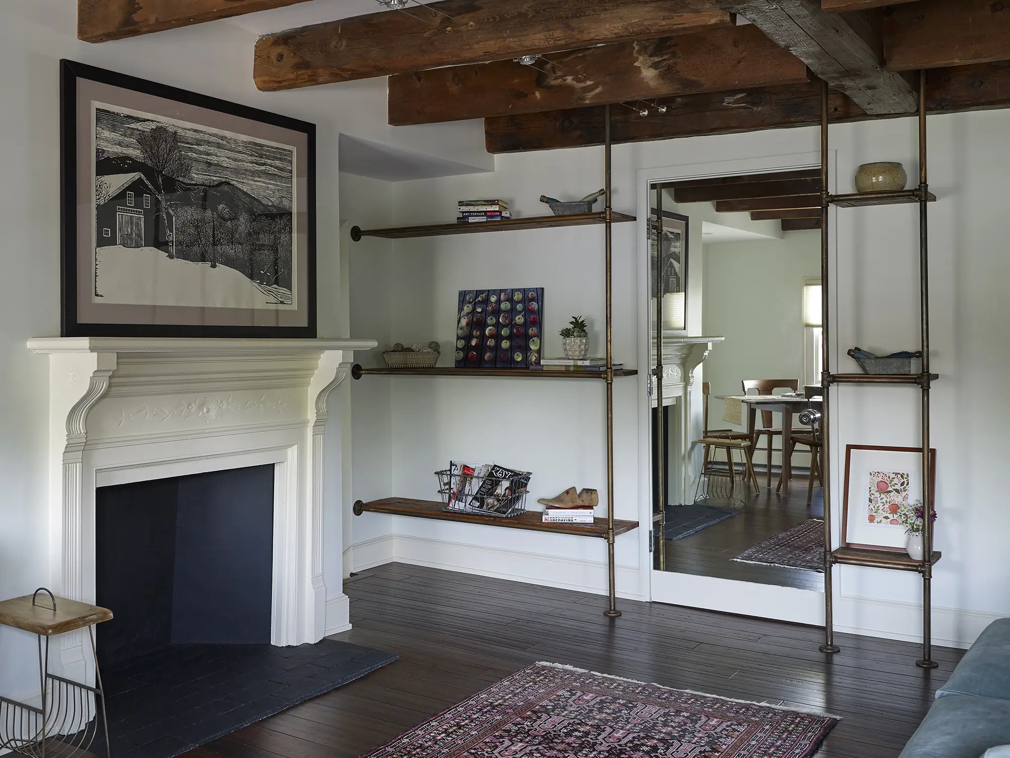 Custom shelving, exposed beams and fireplace
