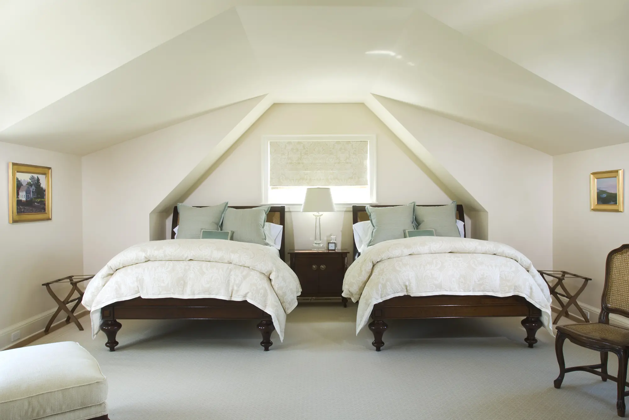 Guest bedroom with slanted ceilings