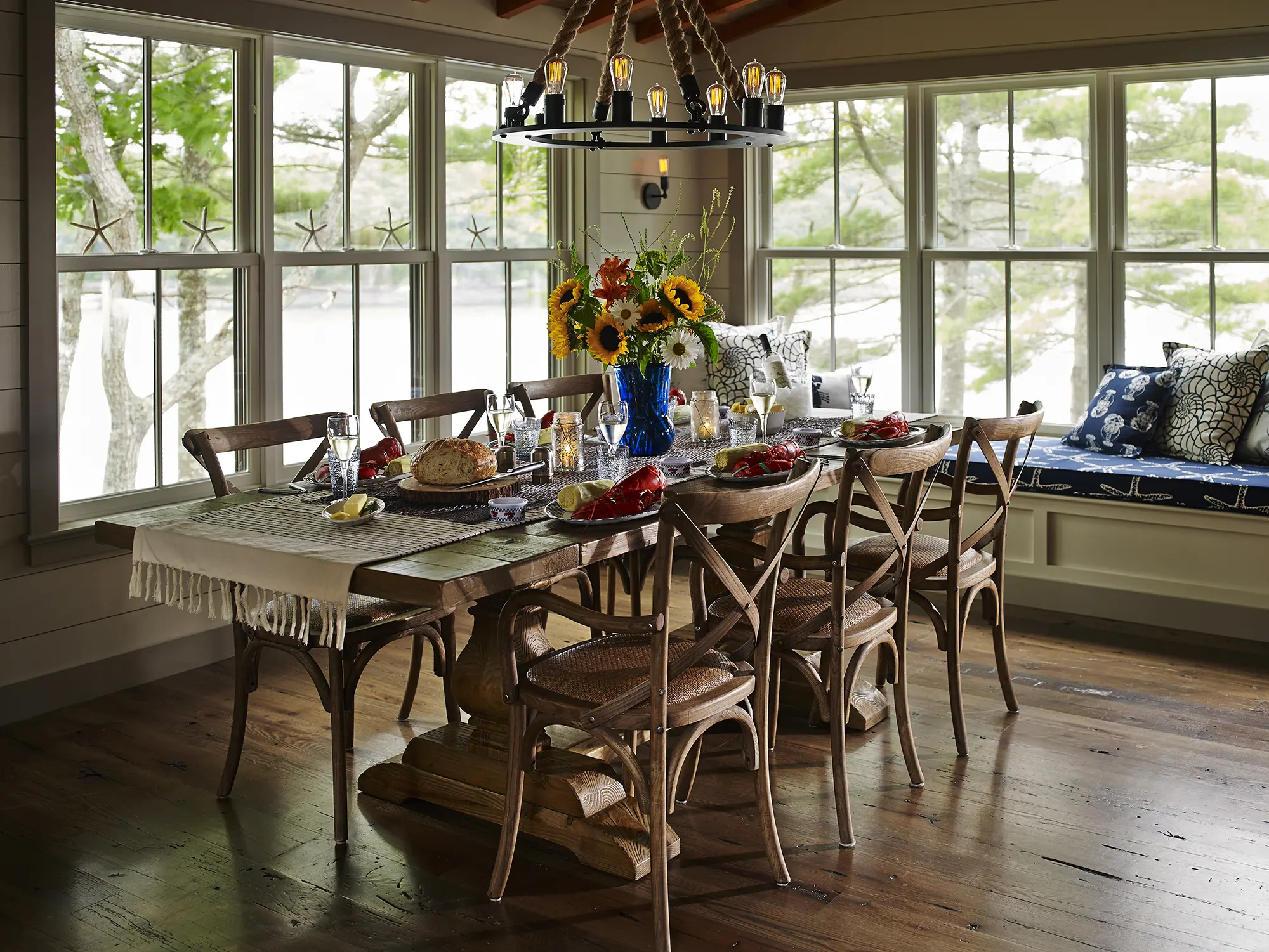 Formal dining room with sweeping water views at the Cross Point Cottages