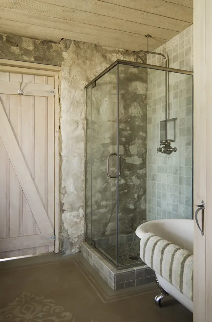 Standing shower and clawfoot tub in the bathroom at Hunting Island Cottage