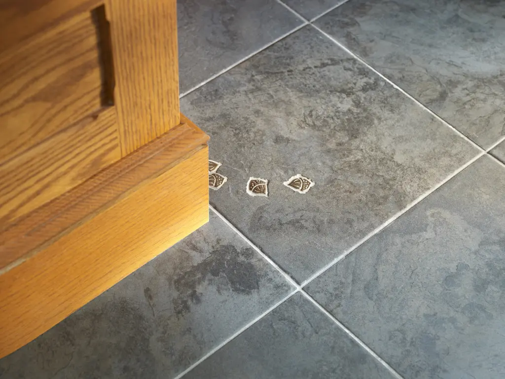 Acorn detail in the floor tiles at Brambletye