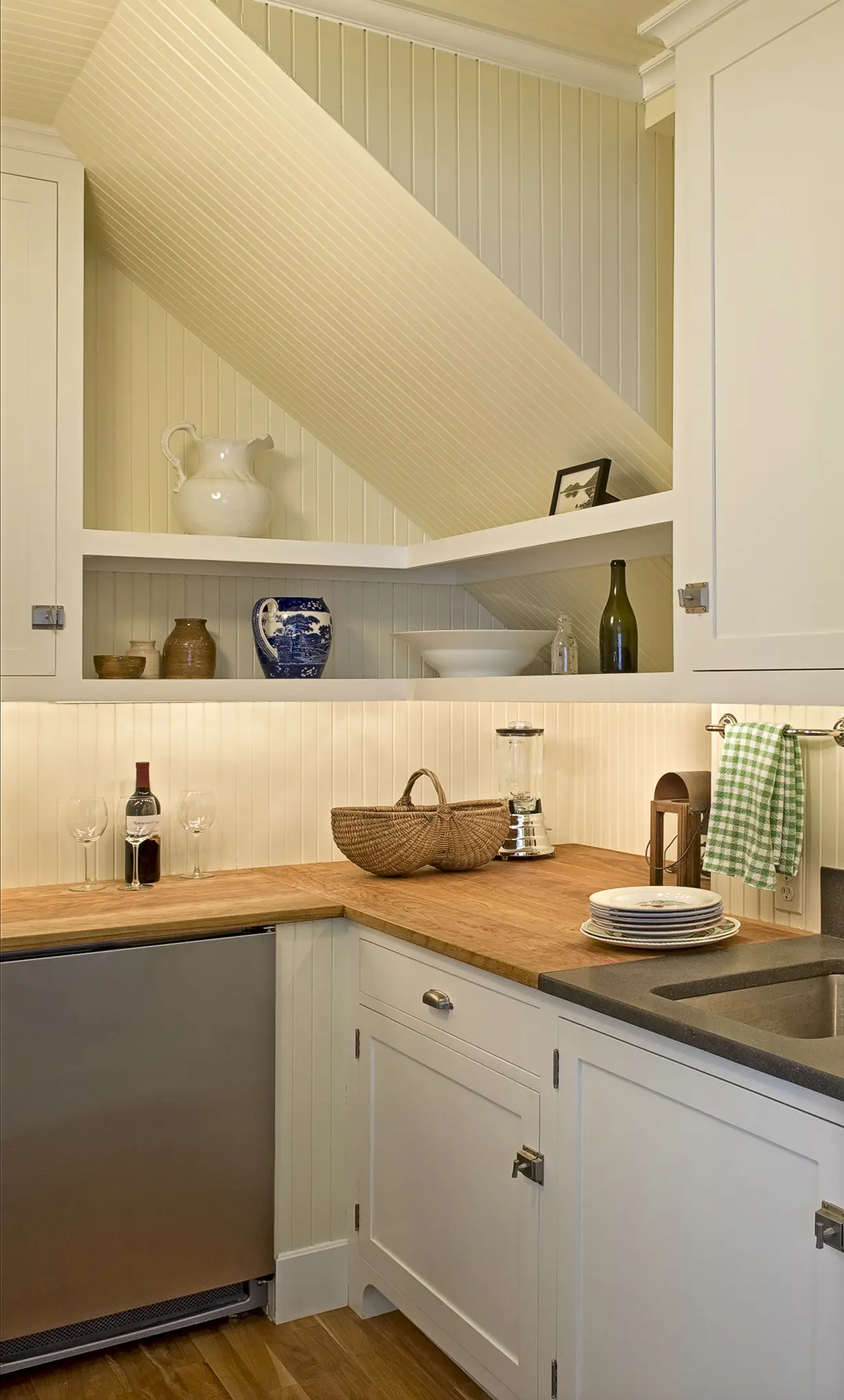 Slanted kitchen walls with cutting board top and paneled walls