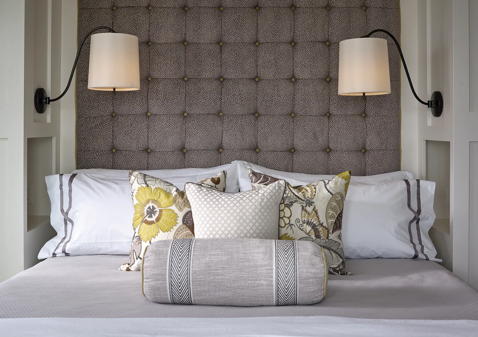 Padded headboard with built in shelves and sconces