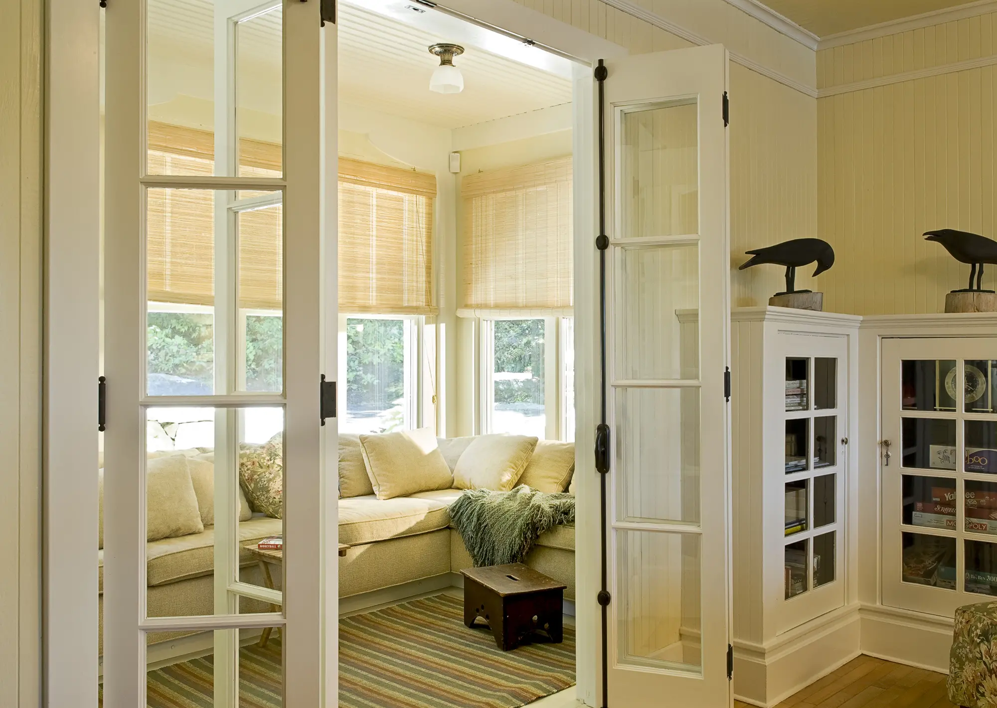 French doors to sun room with reed blinds