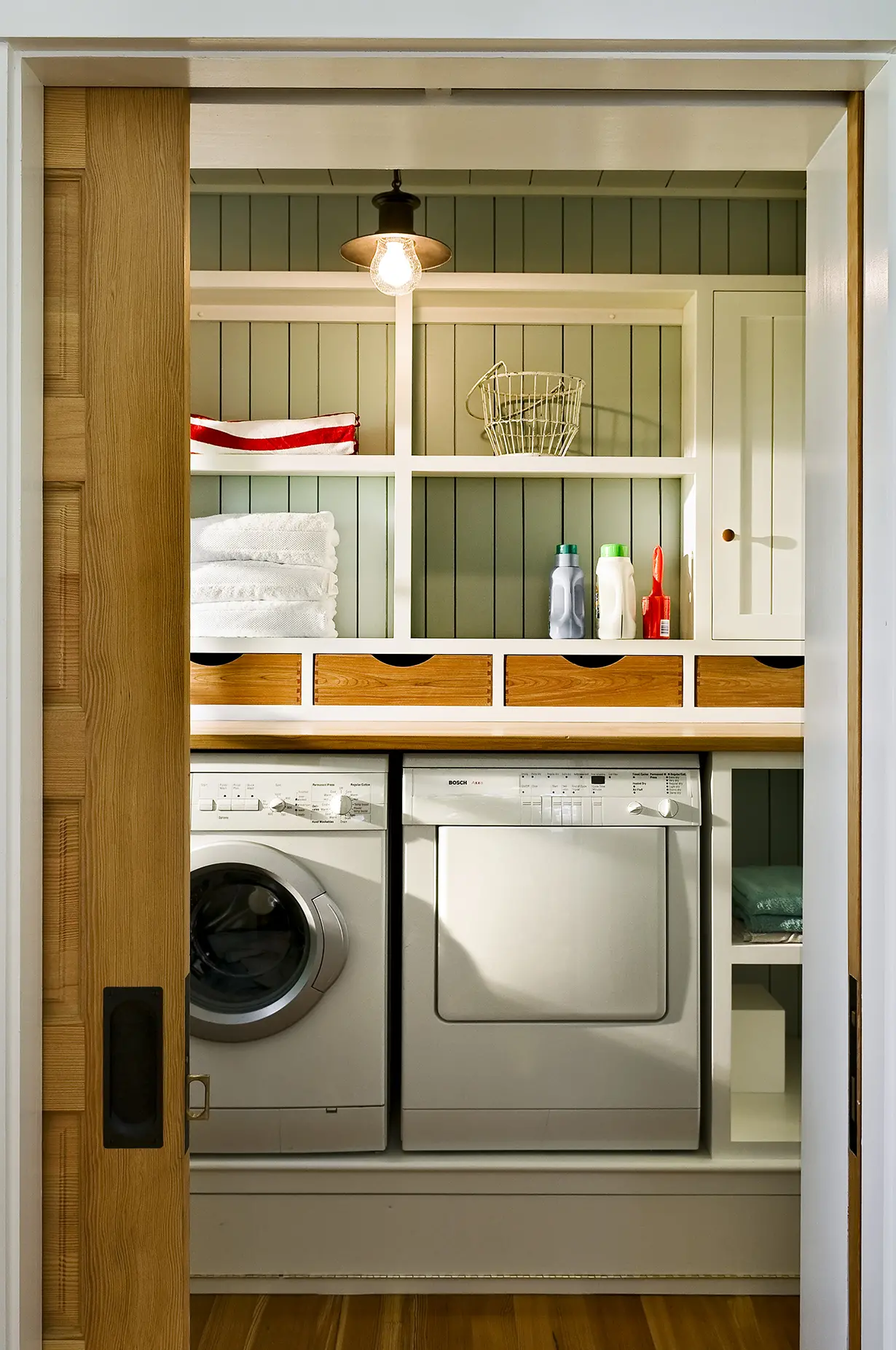 Laundry room with built in storage at Grandview