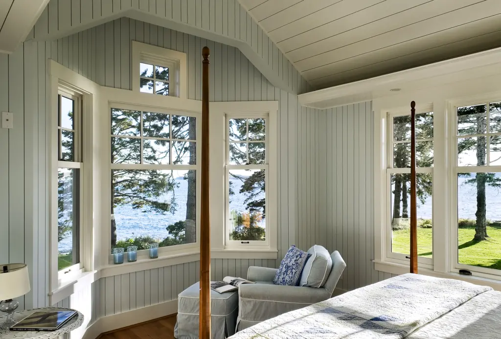 Maine cottage style bedroom with water views at Grandview