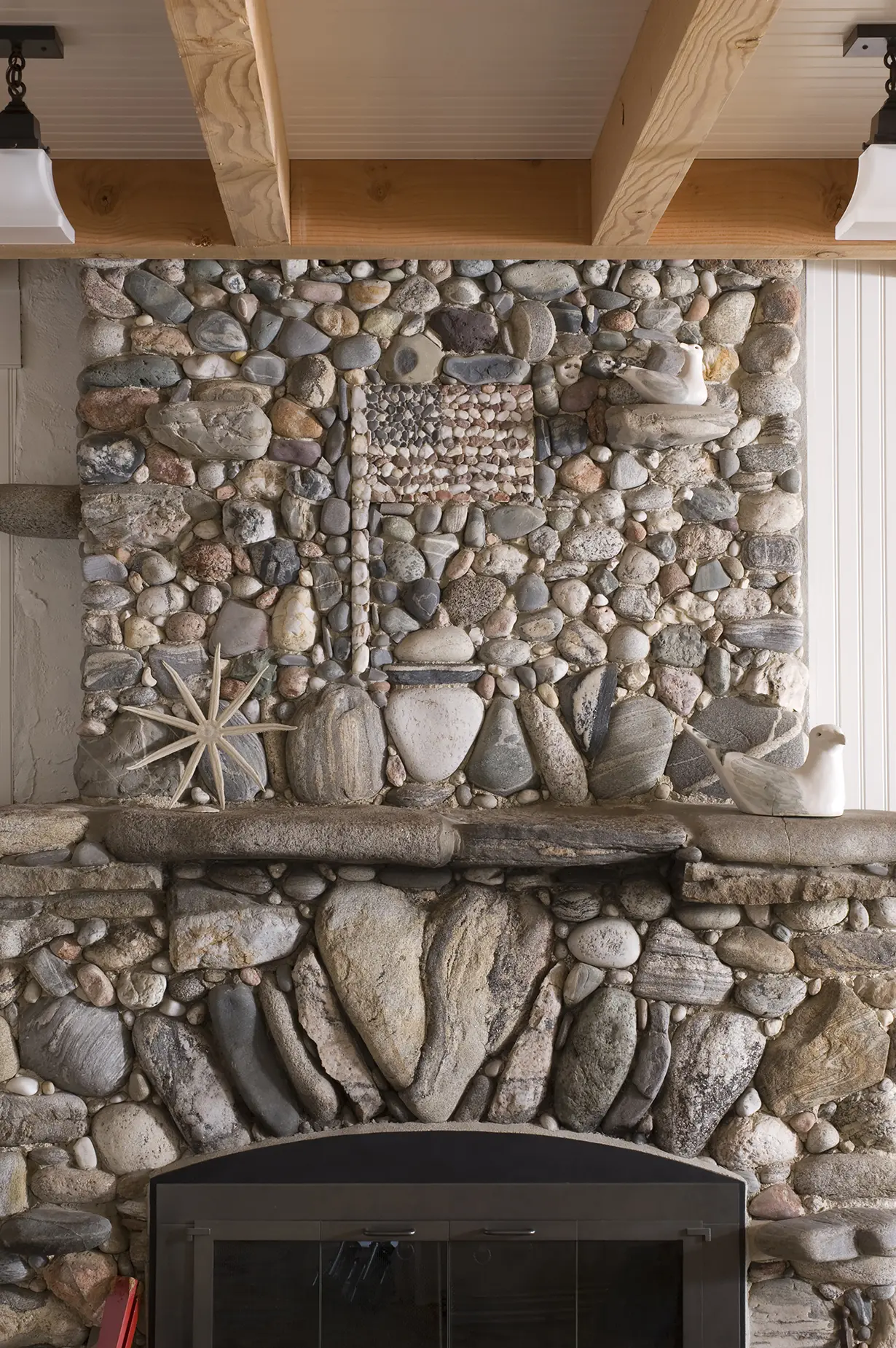 Stone fireplace with American flag detailing at Bayberry