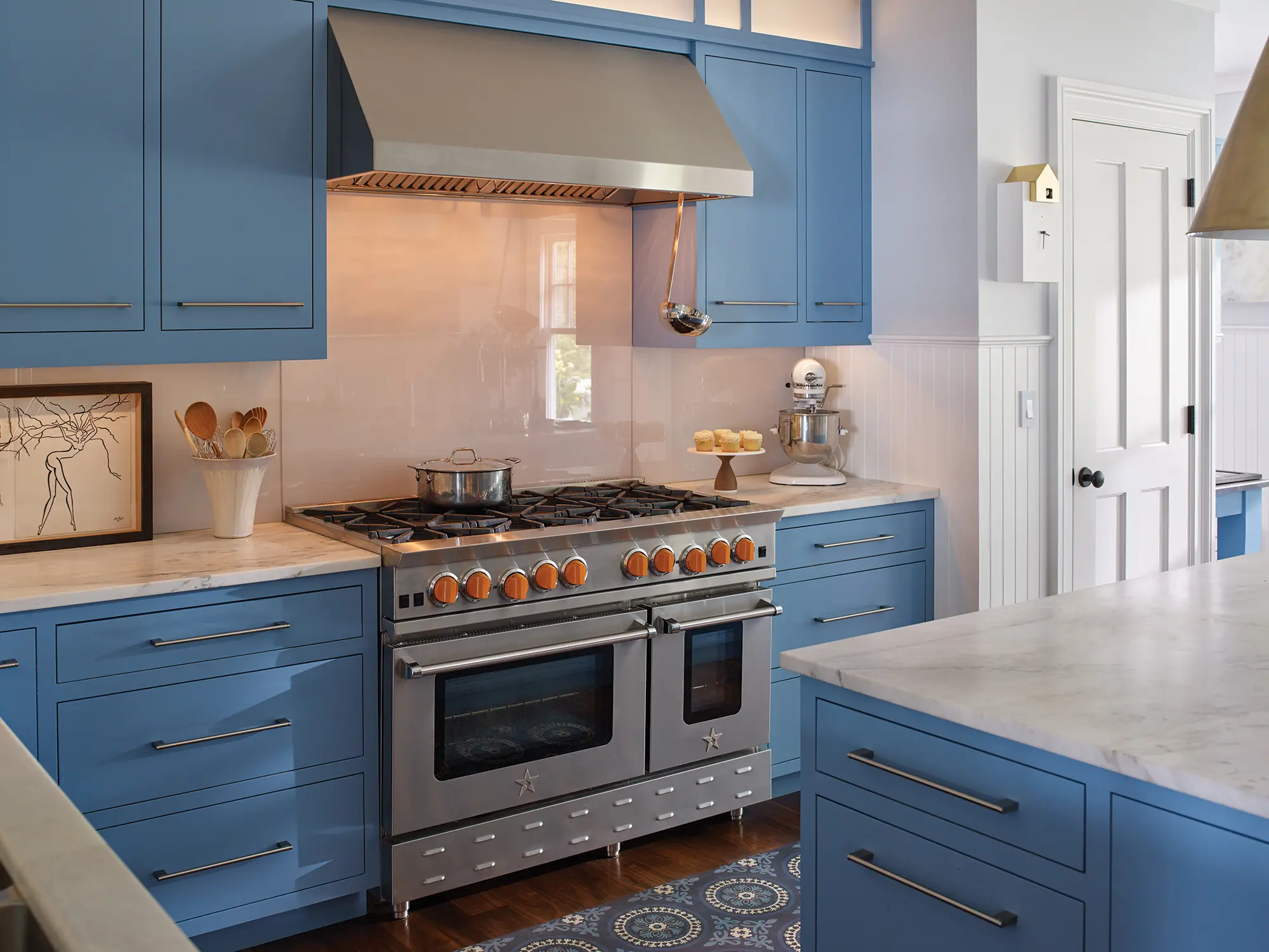 Kitchen at Summer Haven with vibrant blue custom cabinets