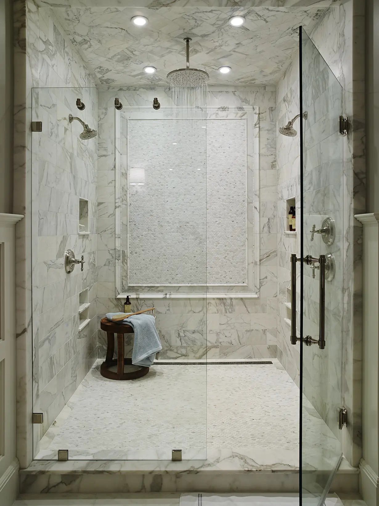 Walk in shower with tile detail and rain shower head