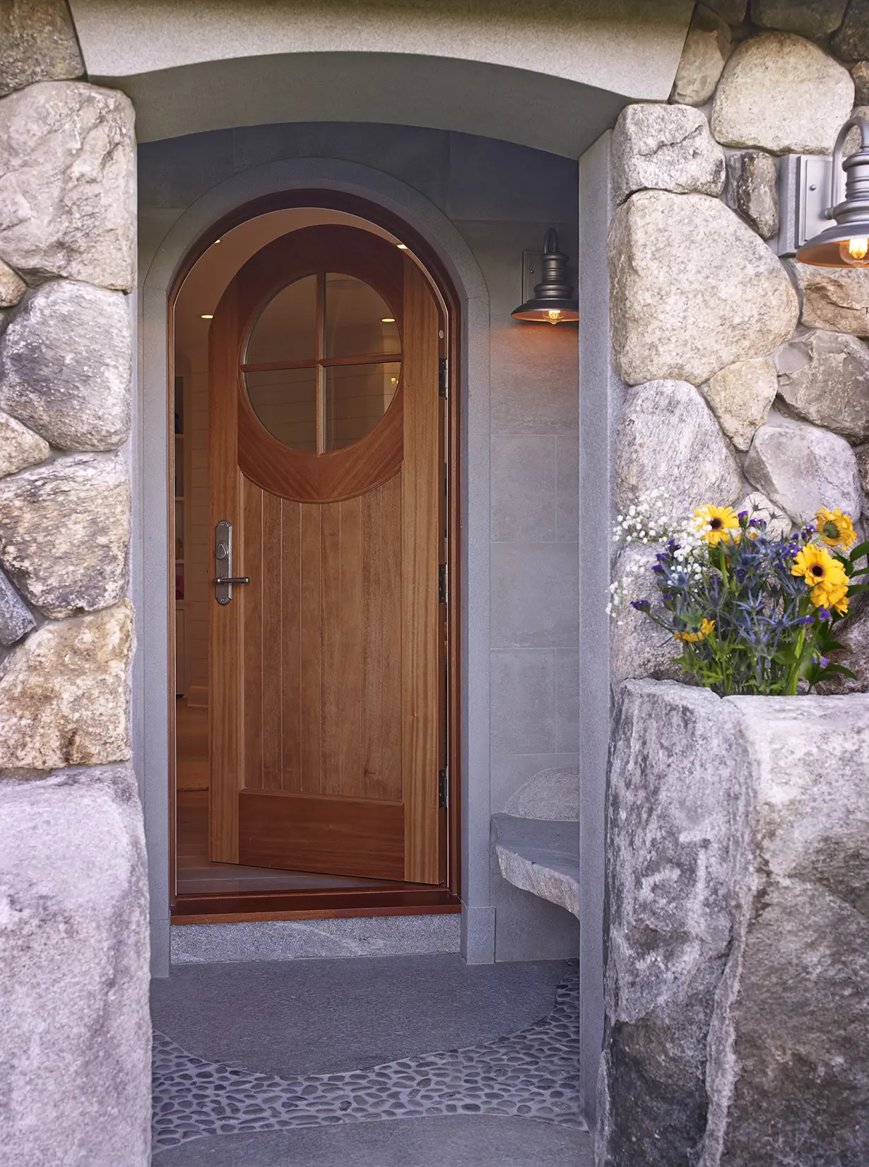 View from entryway of rounded doorway with custom circular window