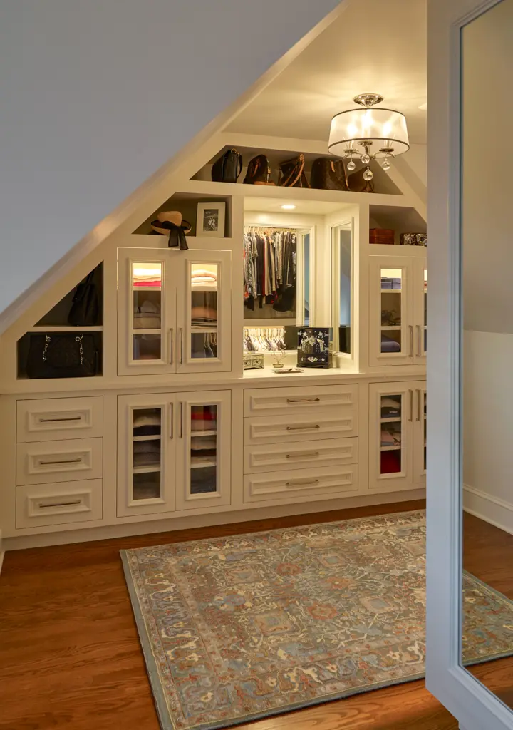 Walk-in closet with large mirror and plenty of storage.