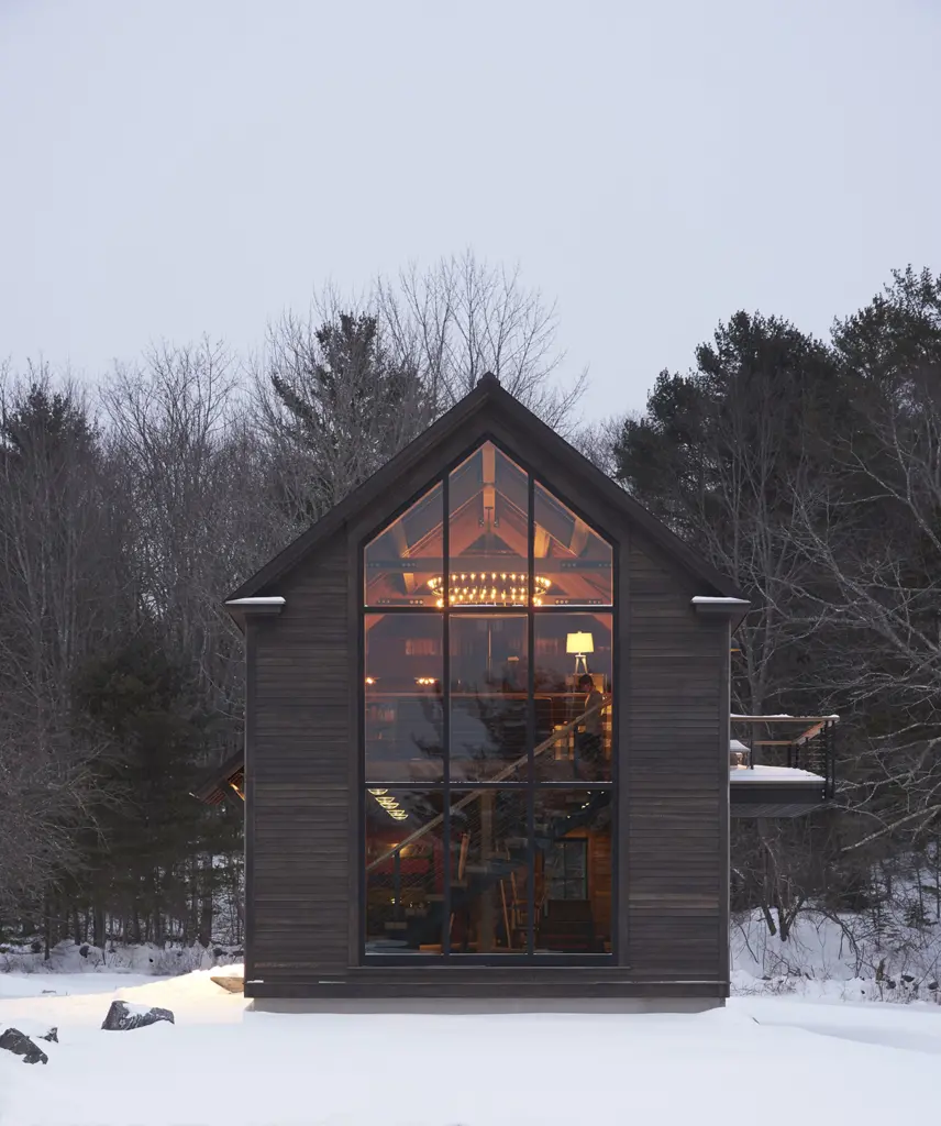 Cozy barn-style home with large picture window wall and eye-catching chandelier