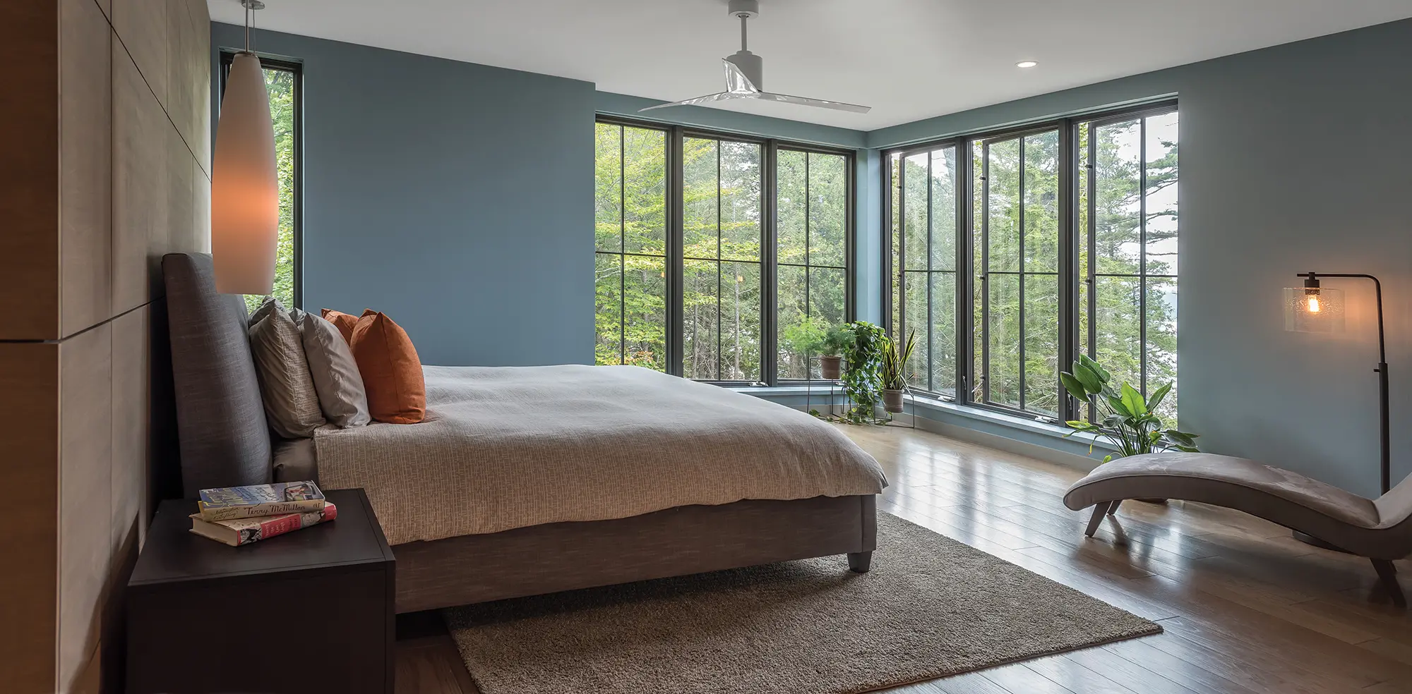 A spacious primary bedroom loaded with natural light and contemporary style.