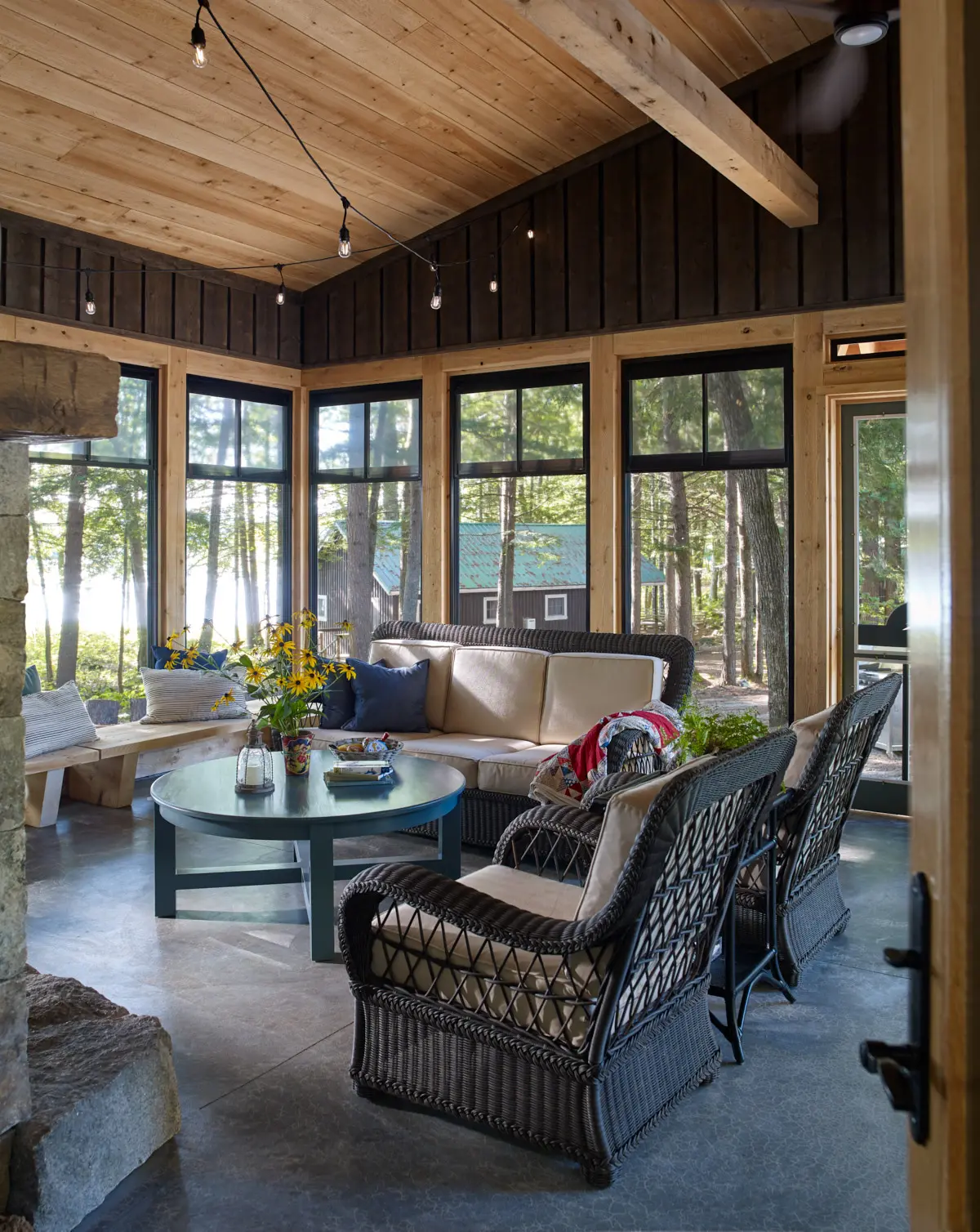 Open living space in the screened in porch at Cozy Bear Cabin
