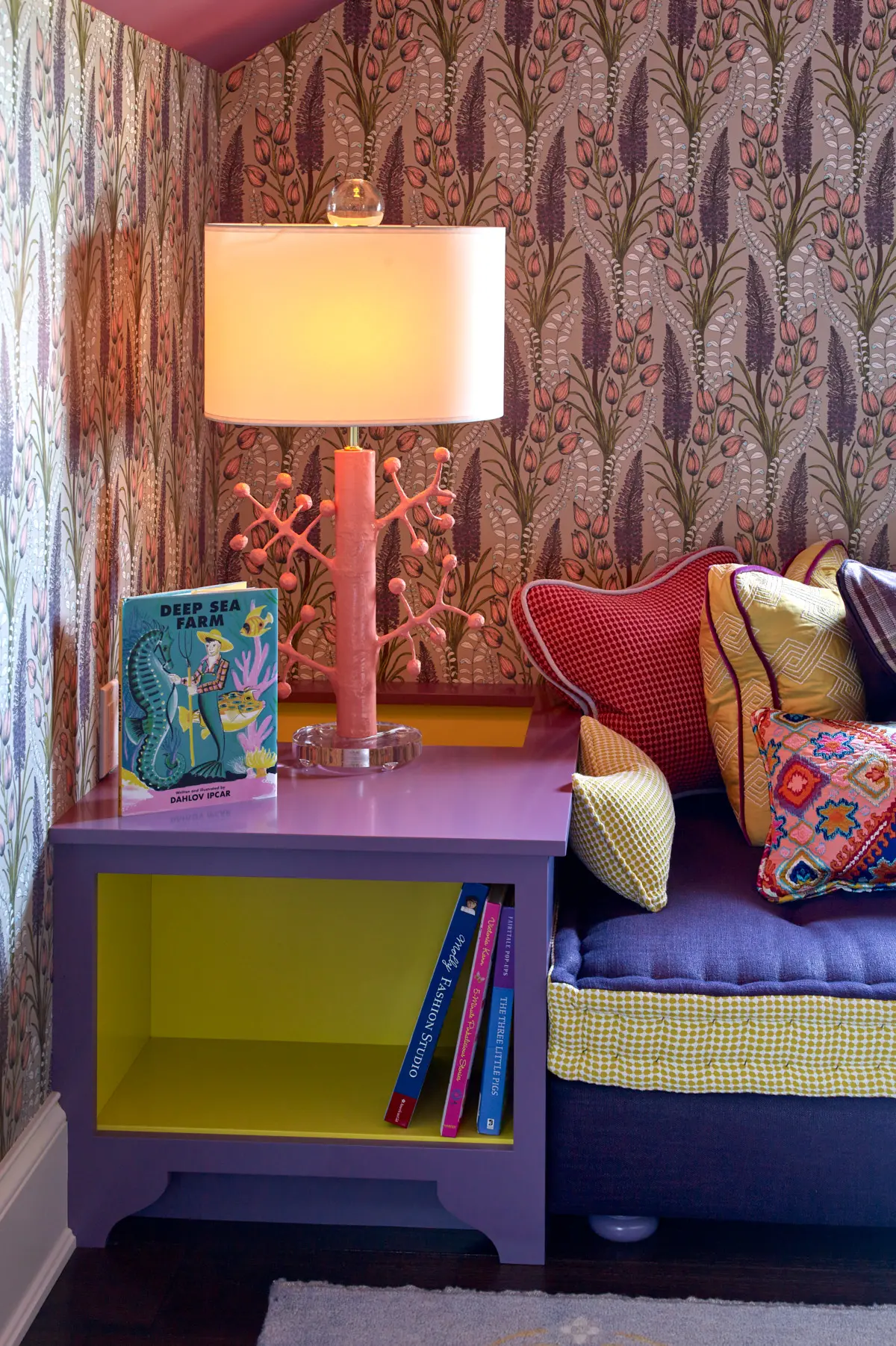 This reading nook sparks imagination with unique wallpaper and coral-inspired light fixture.