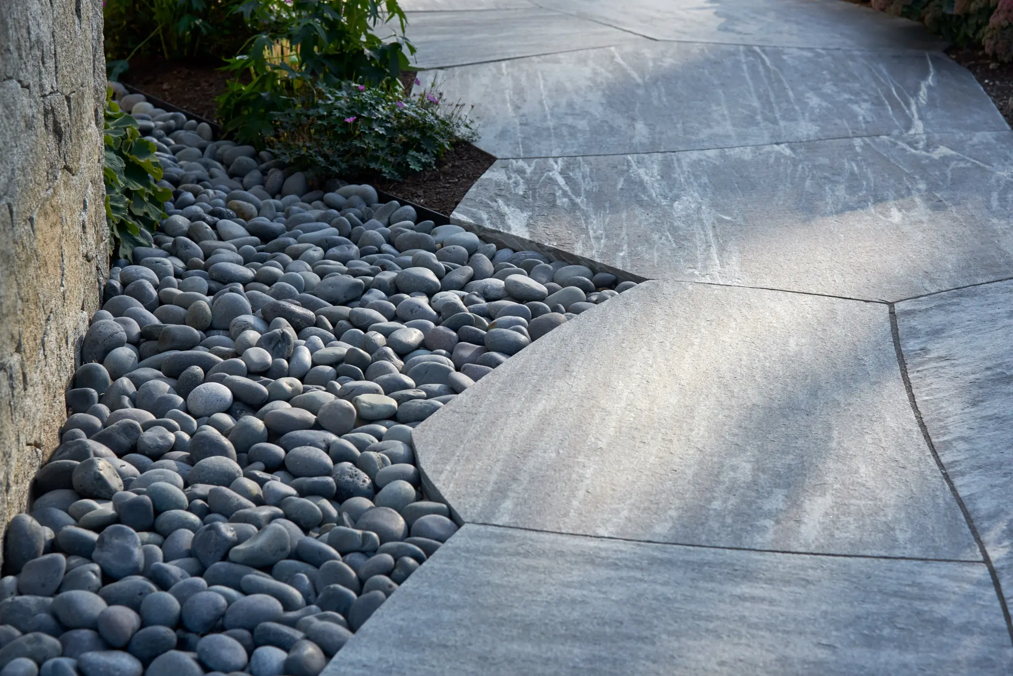 Stonework adds a peaceful atmosphere along the walkway