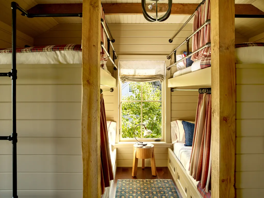 A view of the bunkbeds with privacy curtains.