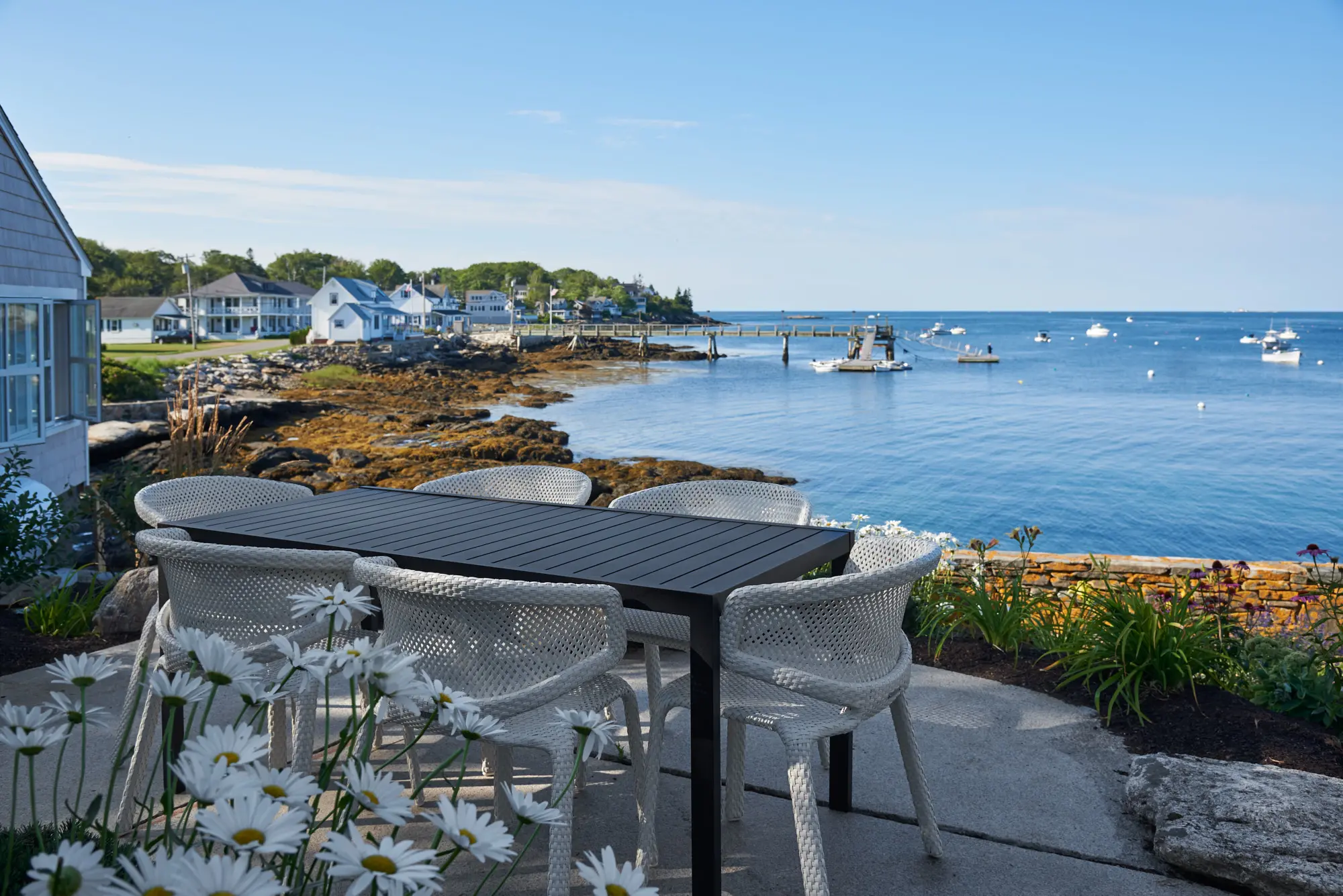 Open patio with floral and coastal views along Twin Cove.
