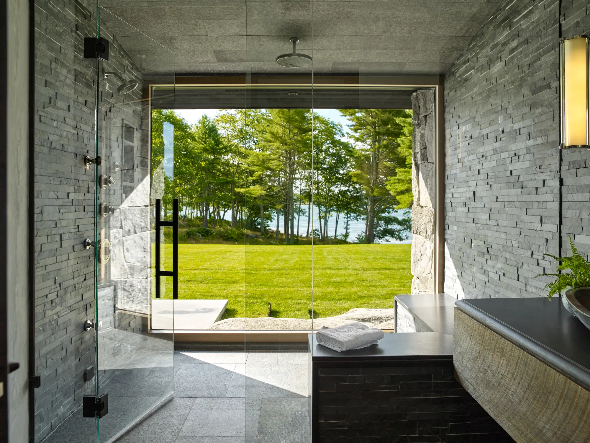 This large glass walled shower has views to the ocean