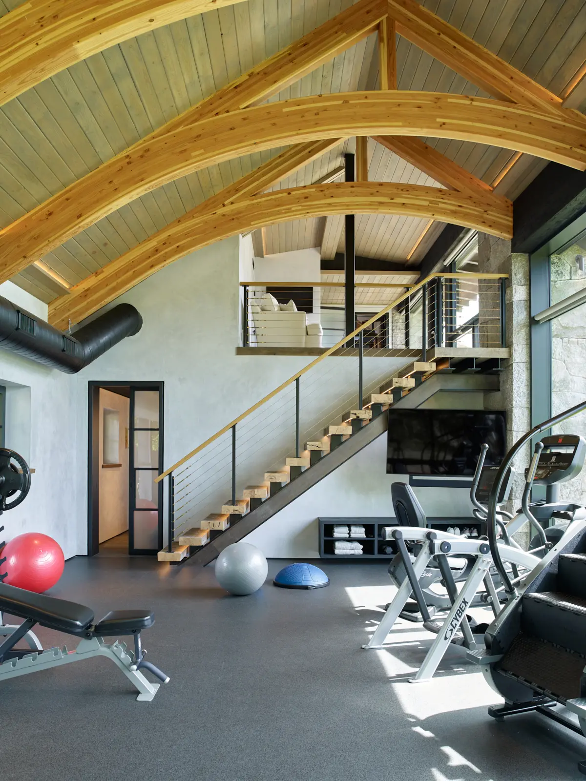 View of the large arching beams in the gym at Stoneview Spa