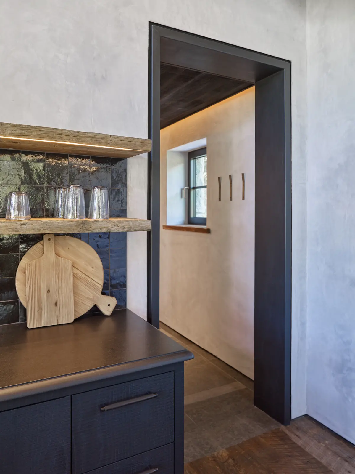 Striking contrast of black door way and neutral walls