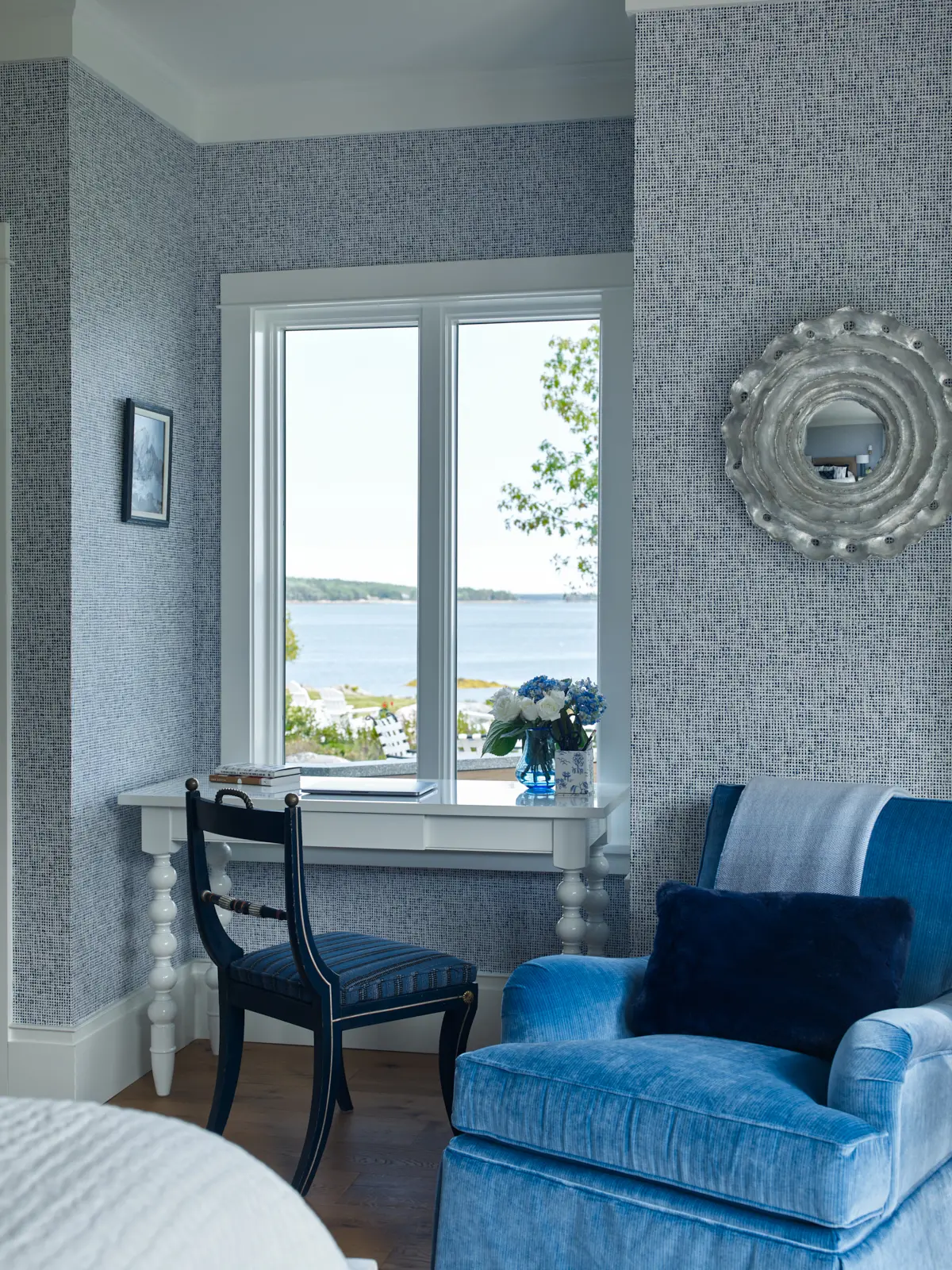 Statement wall paper bedroom overlooking rocky coast