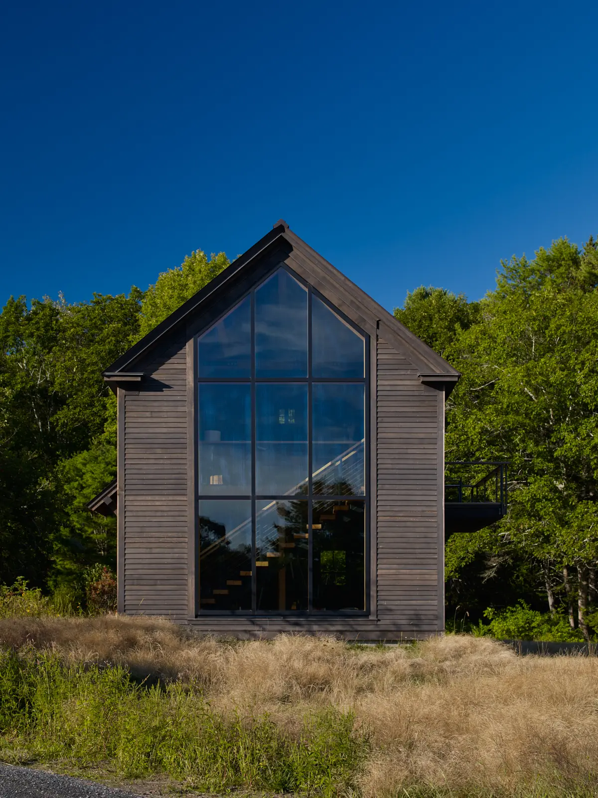 Barn-style home with large picture window wall