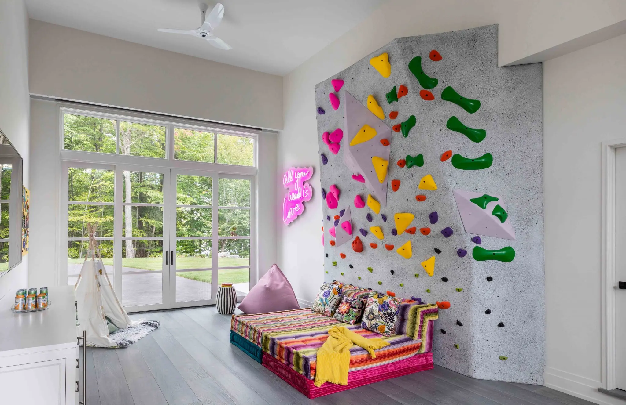 Playroom with rock wall and neon sign