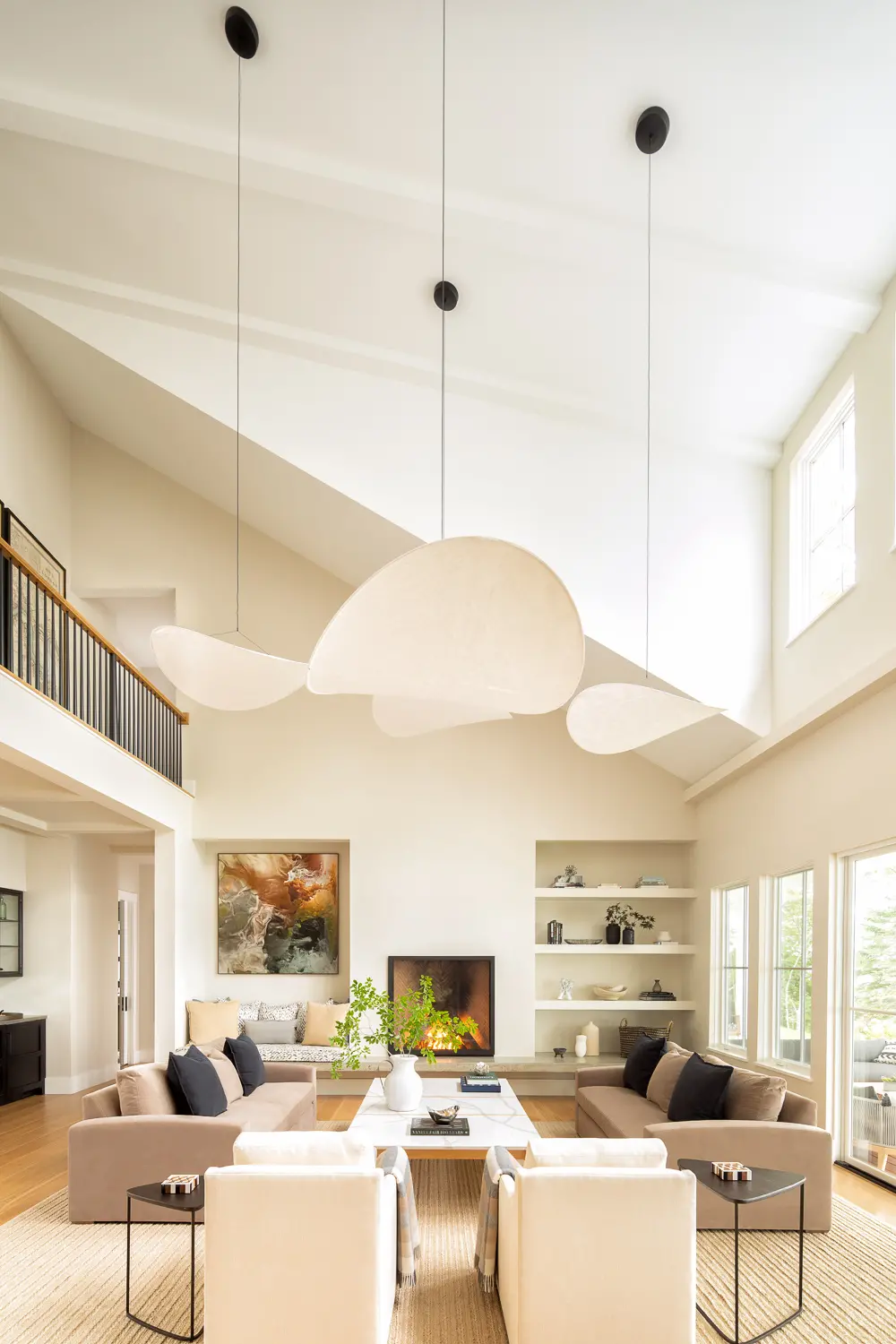 balcony looks over large living room awash in natural light