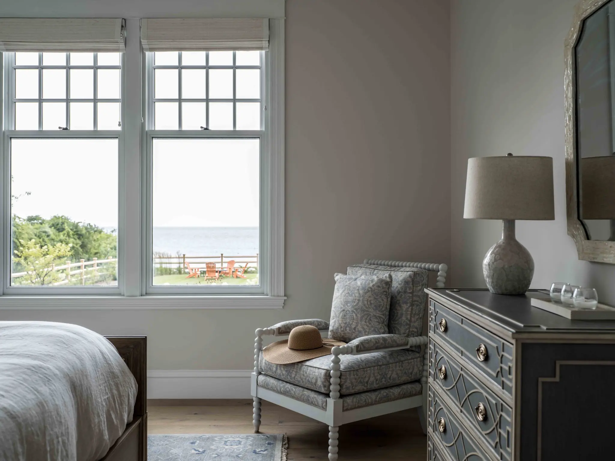Ocean views from the primary bedroom in this Maine home