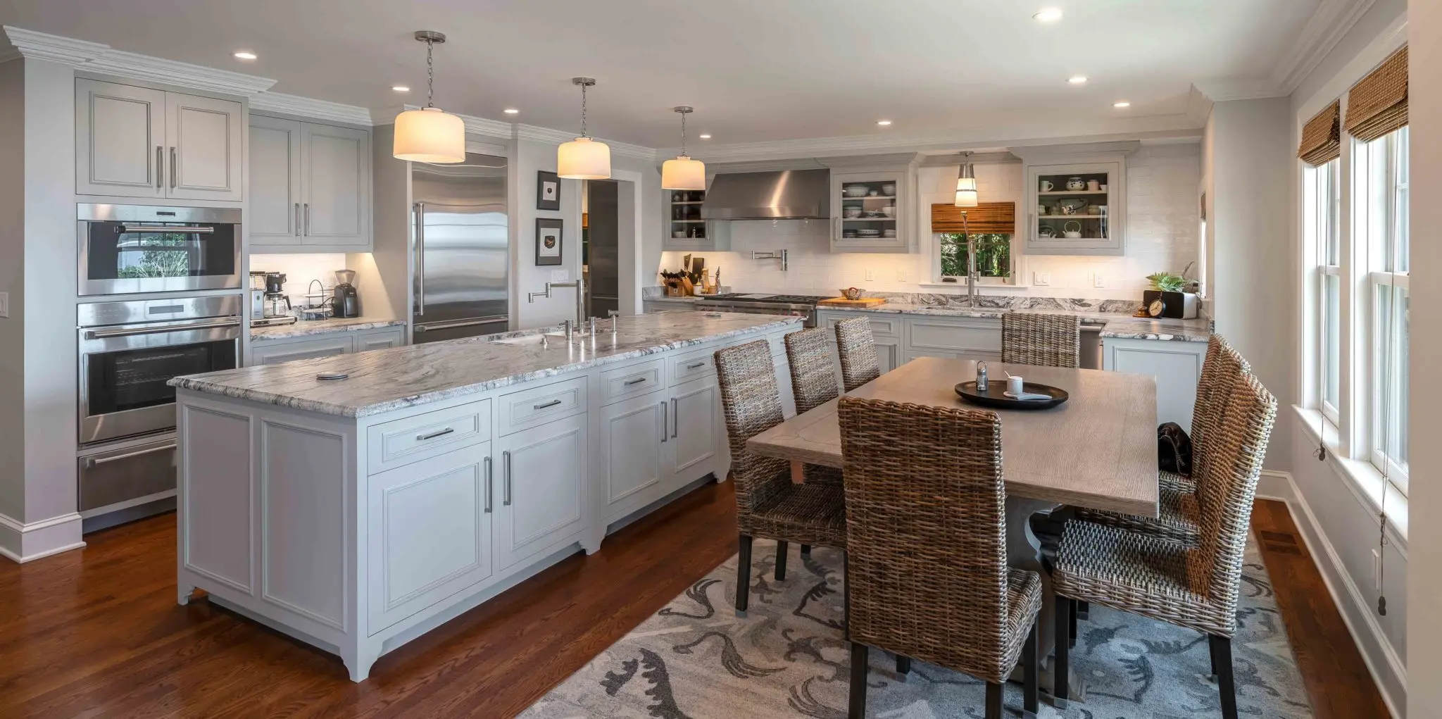 Open kitchen with marble island and dining area